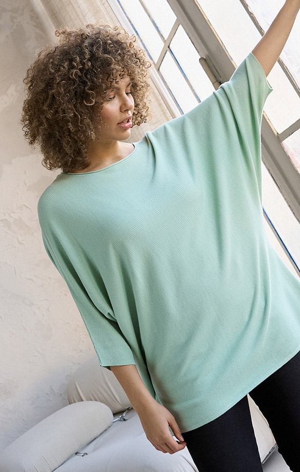 Plus SIze Model with green pullover